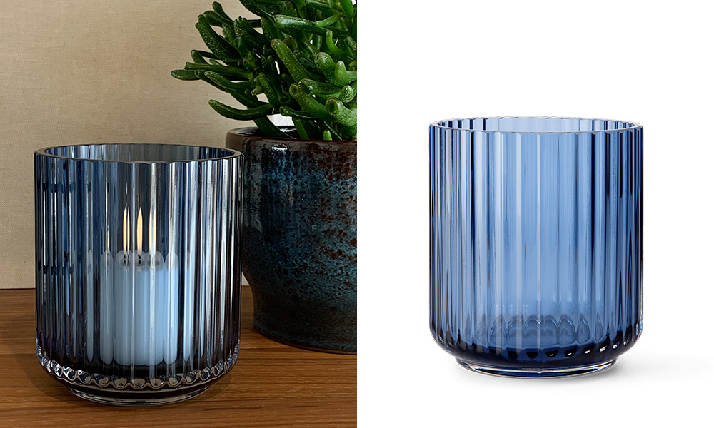 Das Bild zeigt das Lyngby Windlicht in Blau, das elegant und funktional zugleich ist. Das mundgeblasene Glas mit seinen charakteristischen Rillen reflektiert das Licht auf eine Art, die das Windlicht nicht nur als Beleuchtungselement, sondern auch als dekoratives Kunstwerk herausstellt. Die tiefe blaue Farbe und die präzise Formgebung sind eine Hommage an das ikonische Design der Lyngby Vase, das Designliebhaber weltweit seit Jahrzehnten schätzen.